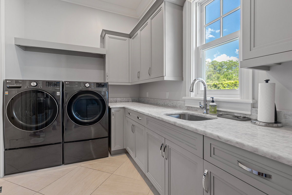 laundry room with white counters